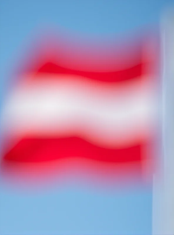 Close-up photo of the Austrian flag waving gently in the wind.