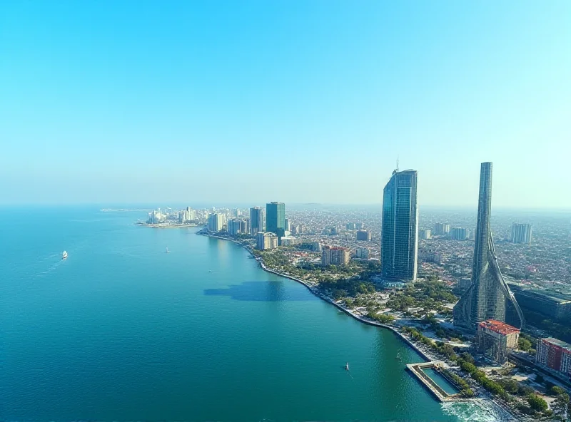 Aerial view of Baku, Azerbaijan, with modern buildings and the Caspian Sea in the background.