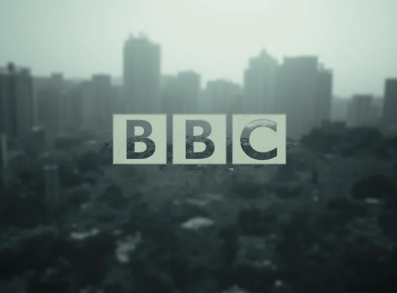 BBC logo with a blurred Gaza cityscape in the background