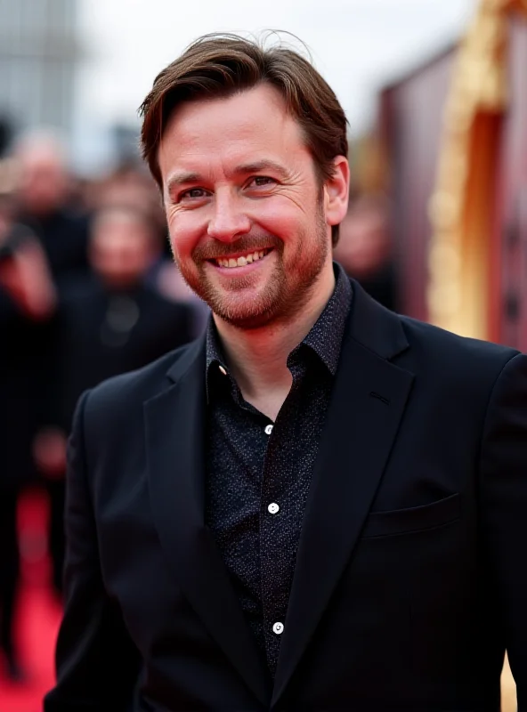 Danny Jones on the red carpet at the Brit Awards, smiling and posing for the cameras