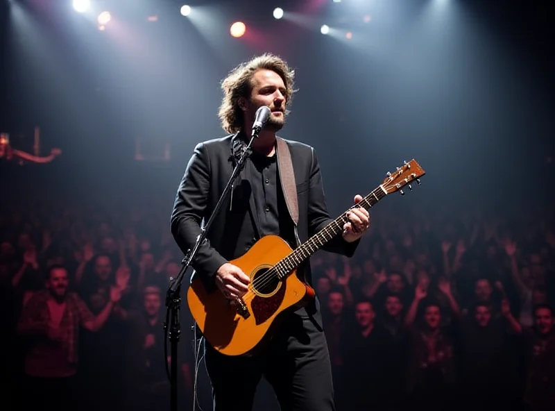 Danny Jones performing on stage with McFly.