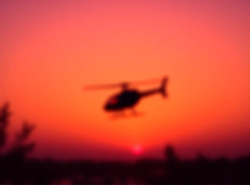 A police helicopter taking off at sunset.