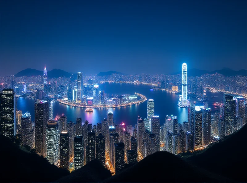 A panoramic view of the Hong Kong skyline at night.