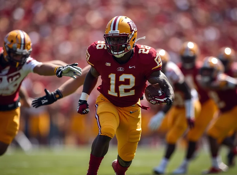 Action shot of a college football player running with the ball during a game.