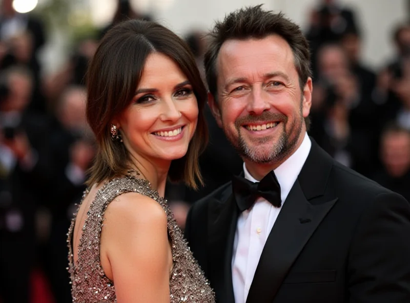 Danny Jones and Georgia Horsley smiling at a red carpet event.