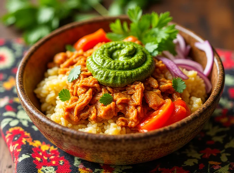 Crockpot chicken bowl with yellow rice, cilantro pesto, pickled onions, and greens.