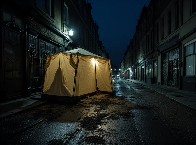 A run-down tent pitched on a Dublin street at night. The area is poorly lit, and the tent appears worn.