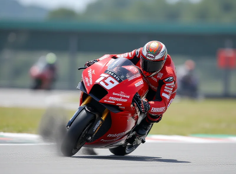 Pecco Bagnaia riding his Ducati MotoGP bike, focused and determined, during a race.