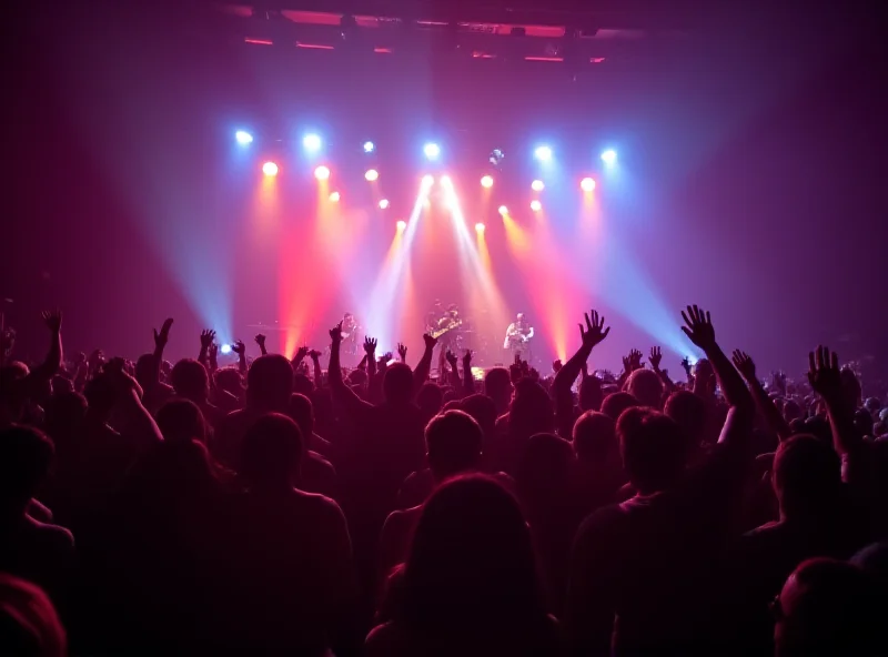 Wide shot of a concert at Movistar Arena in Madrid, showing Carolina Durante performing on stage with the audience cheering.