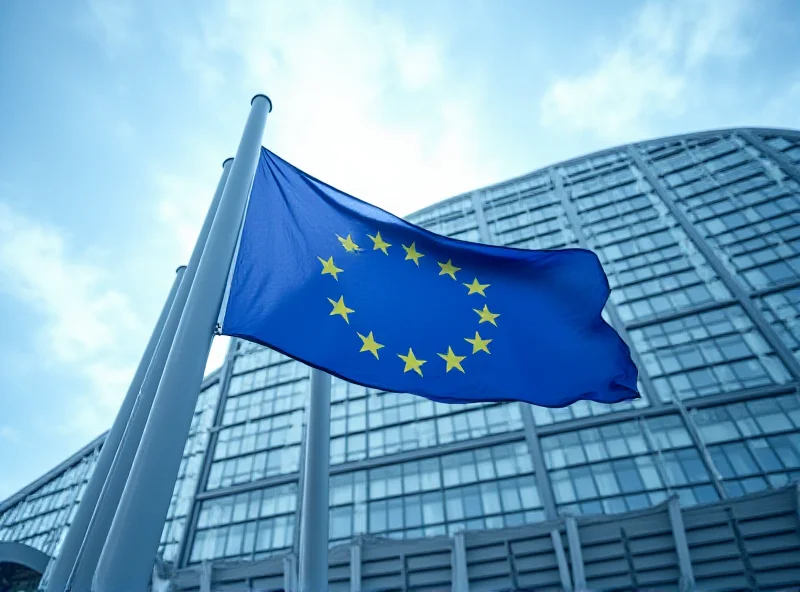 European Commission building with EU flags waving in front.