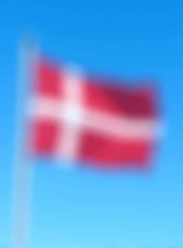 Image of the Danish flag waving in the wind.