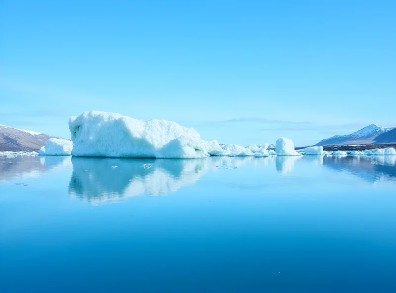 Icebergs floating in a fjord in Greenland under a blue sky