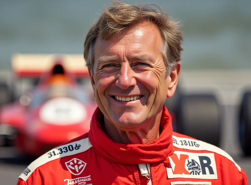 Mario Andretti smiling in his racing suit with a classic F1 car in the background.