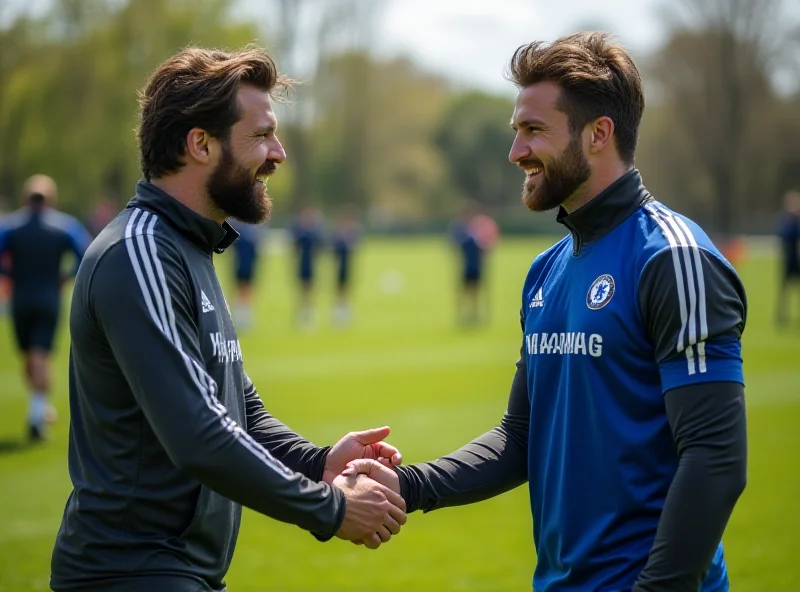 Enzo Maresca and Cole Palmer shaking hands on the training ground.