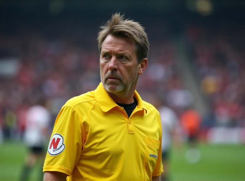 David Coote referee looking serious on the pitch