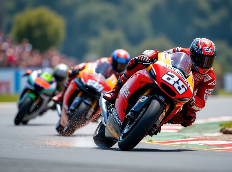 Motorcycle racing on a track, blurred background.