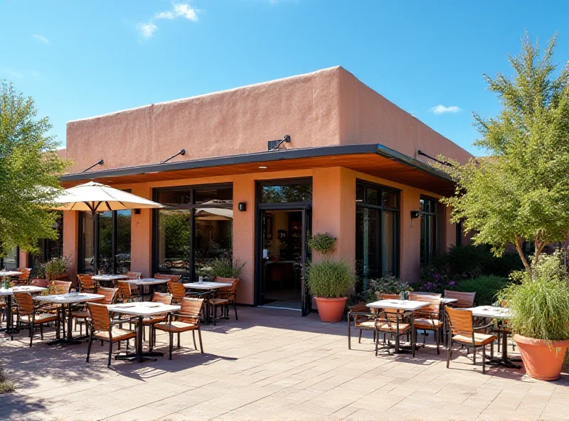 The exterior of a modern restaurant with outdoor seating in Santa Fe, New Mexico.