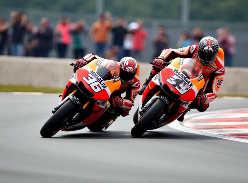 Marc and Alex Marquez racing on their MotoGP bikes.