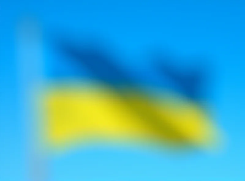 Image of the Ukrainian flag waving in the wind, symbolizing resilience and national identity.