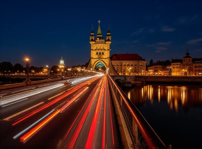 A long exposure photograph of the Grunwaldzki Bridge in Krakow at night, showing car light trails.