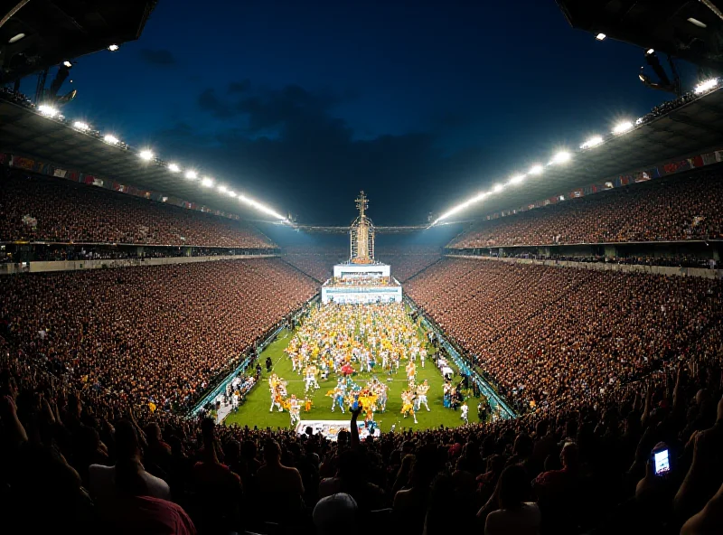 A wide shot of the Marquês de Sapucaí during the Rio Carnival, showing the grandstands packed with spectators and a vibrant samba school procession in the background.