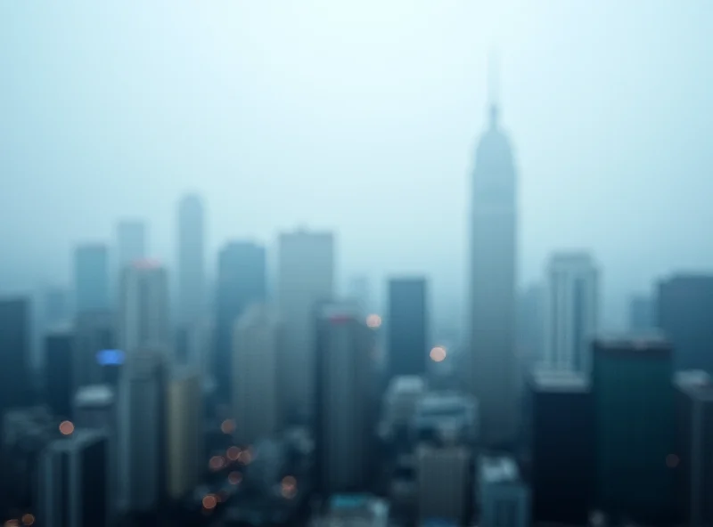 A cityscape of Hong Kong shrouded in a misty, cold weather atmosphere.