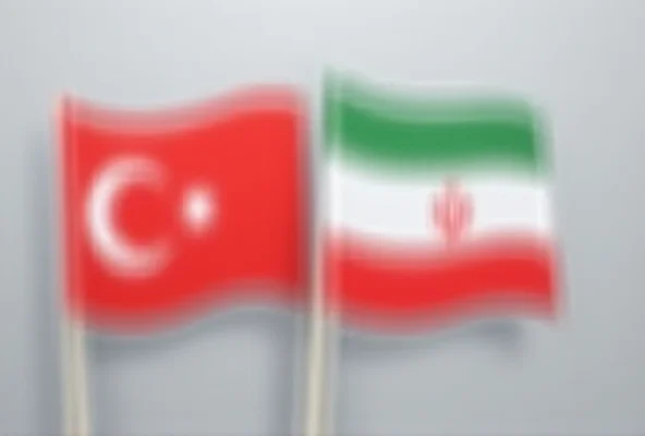 Image of the Turkish and Iranian flags juxtaposed, symbolizing diplomatic relations.