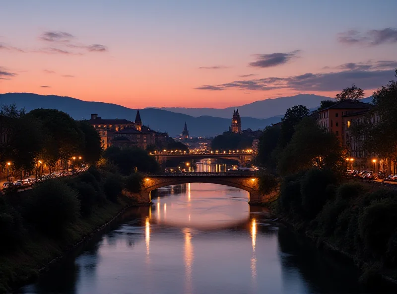 The Verona city skyline at dusk, with the Adige River in the foreground.