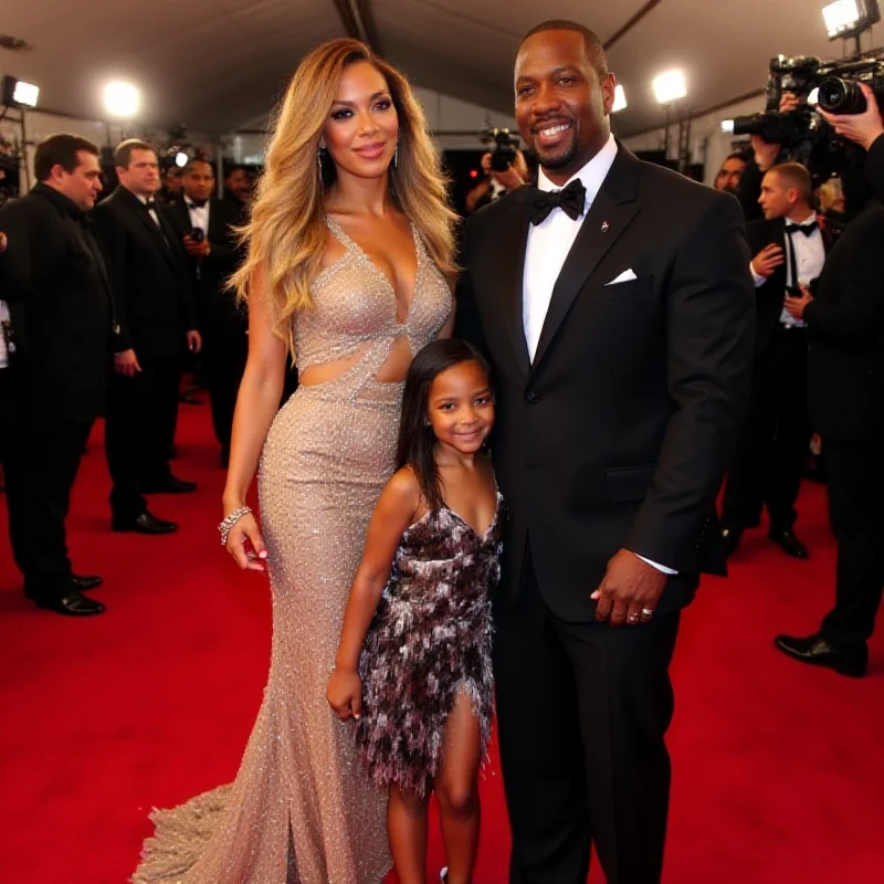 Beyonce, Jay-Z and Blue Ivy posing together on a red carpet