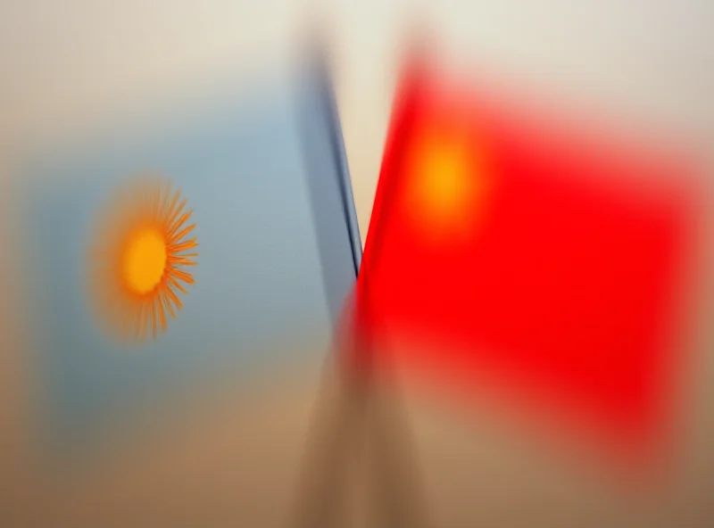 A Kyrgyz and Vietnamese flag waving side by side