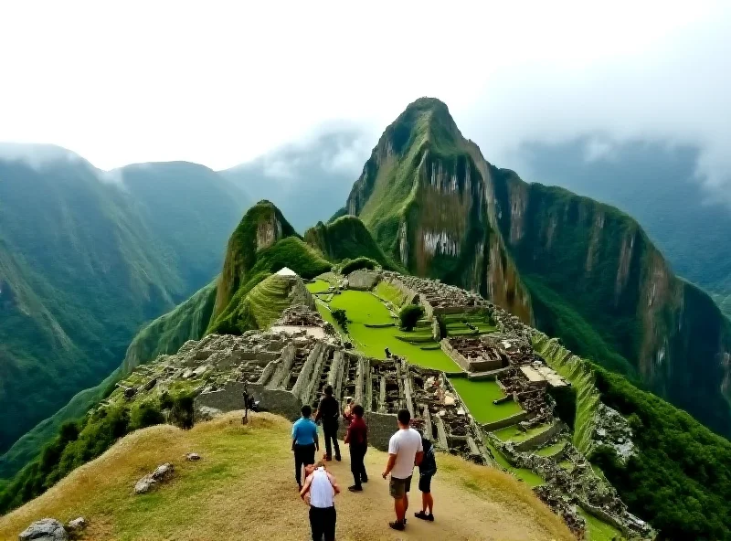 A stunning view of Machu Picchu shrouded in mist, taken from a high vantage point, with hikers visible in the foreground.