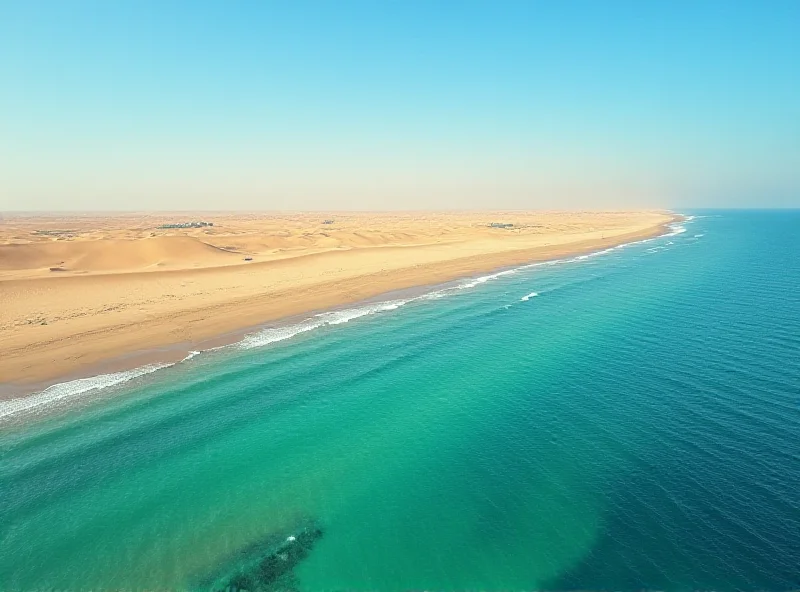 An aerial view of Dakhla, showing the desert meeting the Atlantic Ocean, with clear blue waters and sand dunes stretching into the distance.