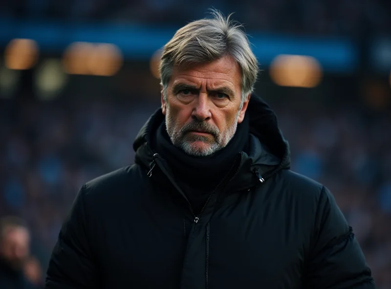 Pep Guardiola looking concerned on the sidelines during a Manchester City game