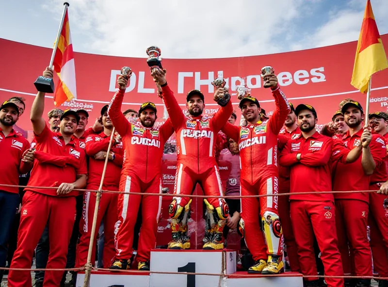 A wide shot of the Ducati team celebrating on the podium in Thailand, showing Marc Márquez, Alex Márquez, and Pecco Bagnaia.