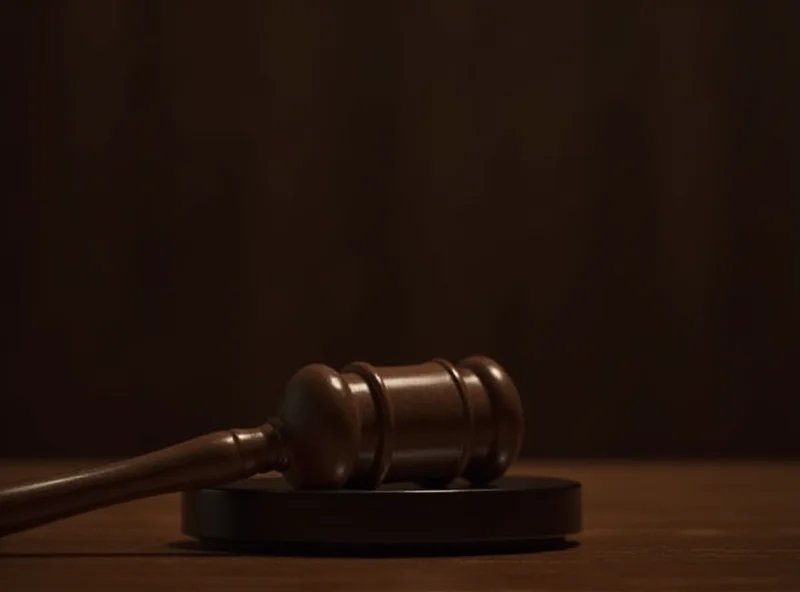 Gavel resting on a sound block in a courtroom.