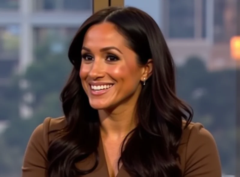 Meghan Markle smiling warmly during an interview.