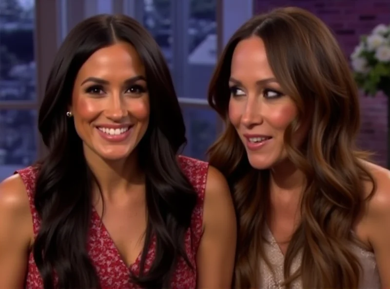 Meghan Markle and Drew Barrymore smiling during an interview.