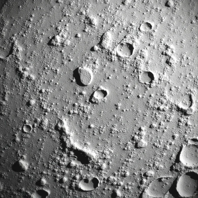 A photo of the moon's surface with the lunar south pole prominently visible.