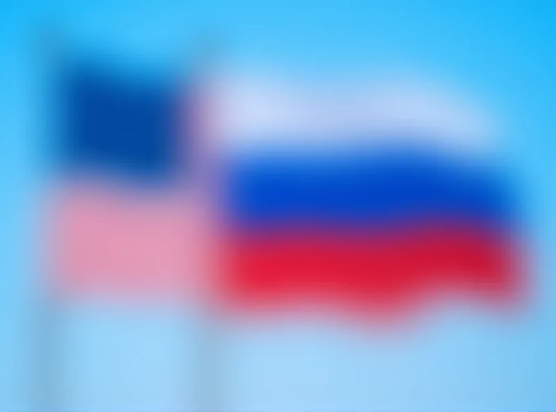 Image of the American and Russian flags waving side by side.