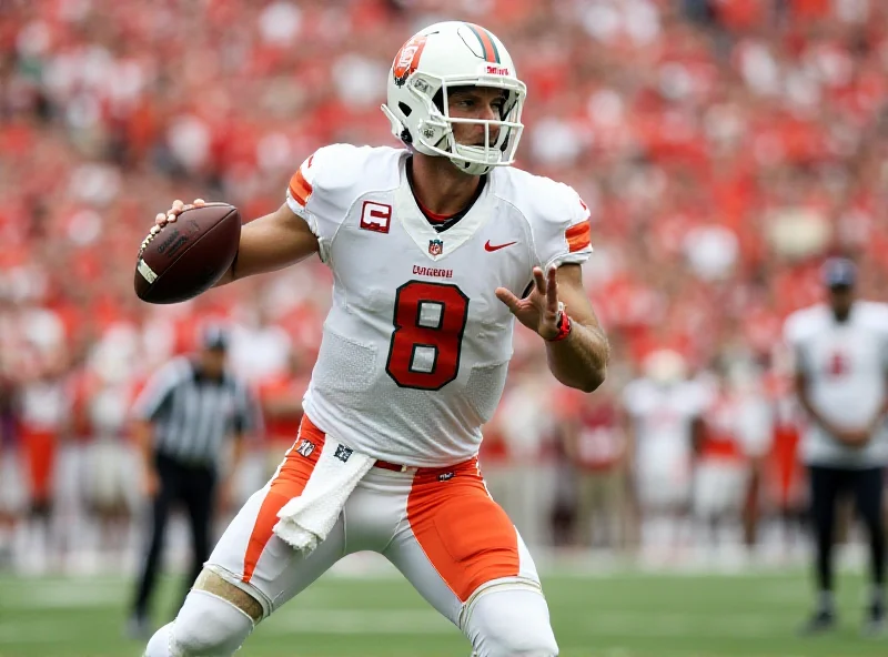 Cam Ward throwing a football during a Miami Hurricanes game.