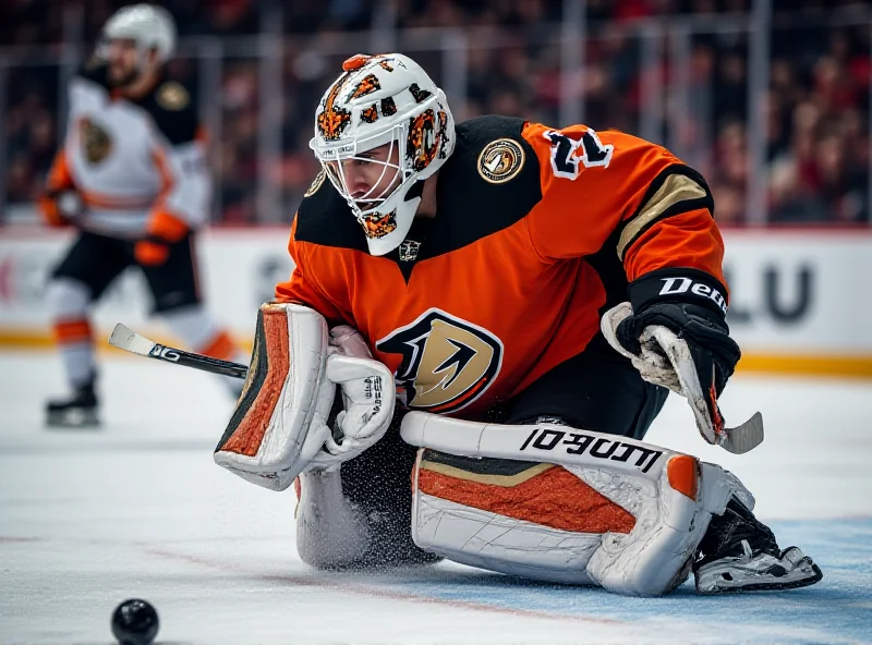 Lukas Dostal making a save during an NHL game.