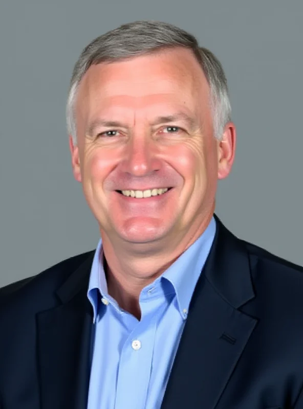 Professional headshot of Noel Quinn, former HSBC CEO, smiling confidently against a neutral background.