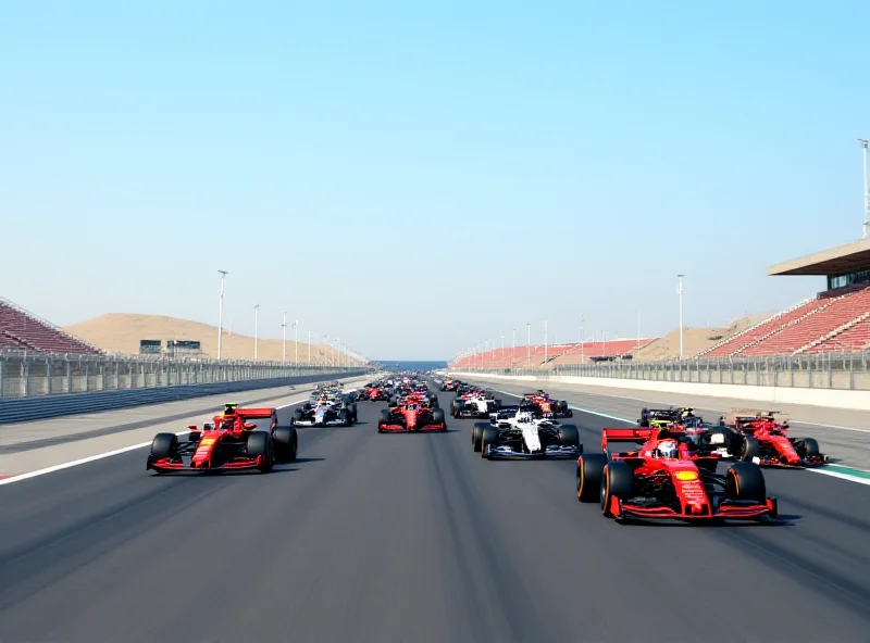 A wide shot of the Bahrain International Circuit during the Formula 1 pre-season testing, showing multiple cars on track.