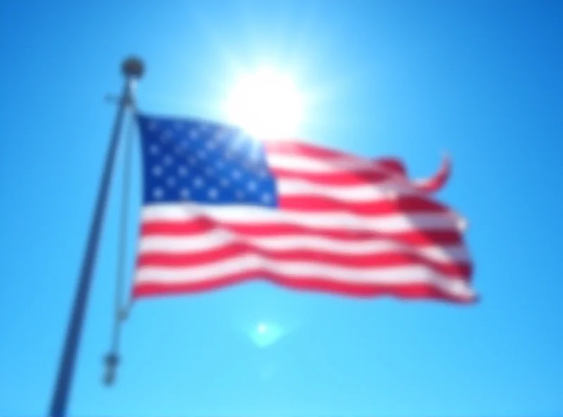 American flag waving proudly in front of a clear blue sky