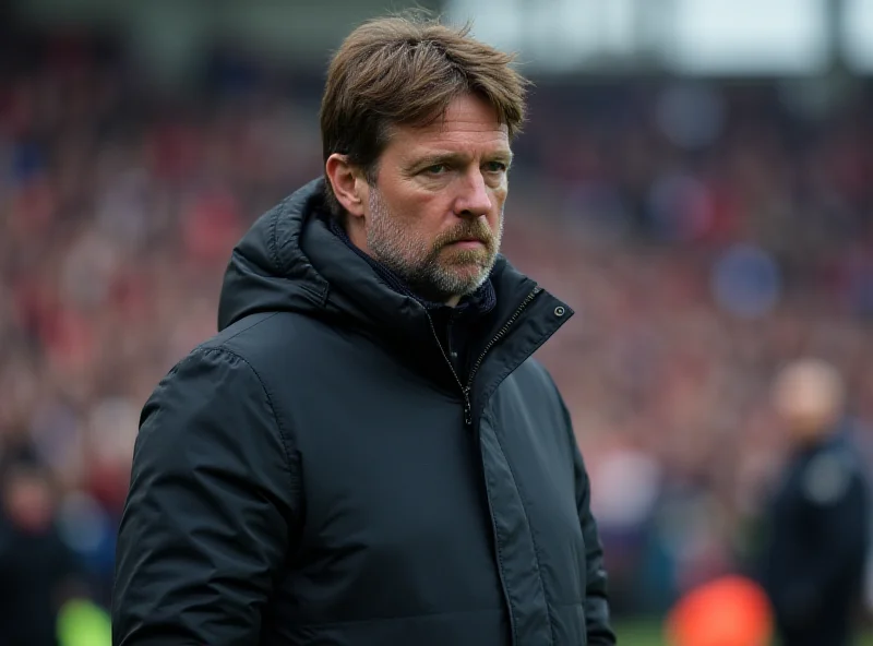 Brighton manager Fabian Hürzeler on the sidelines during a Premier League match, looking focused and determined.