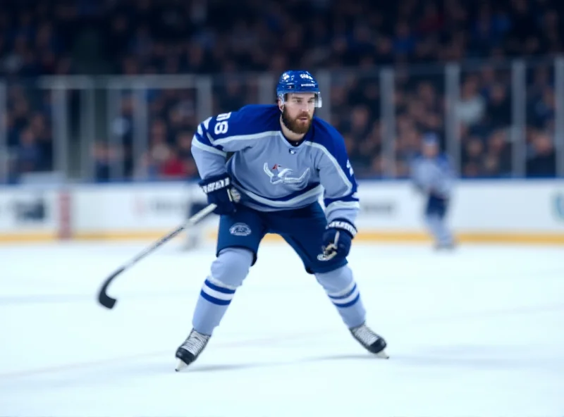 Marian Studenič skating on the ice in a hockey game, wearing a blue and white jersey.