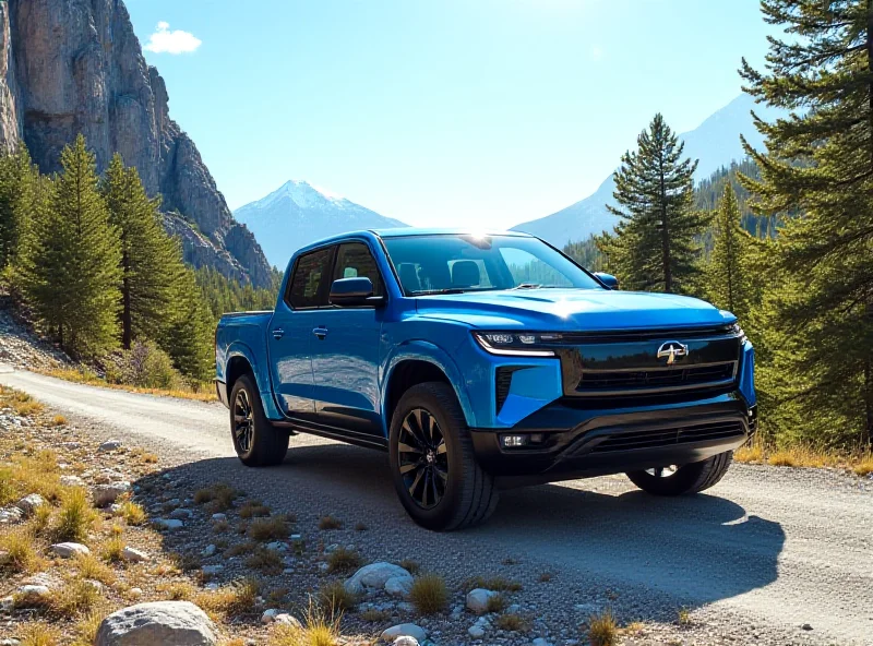 Rivian electric truck driving on a mountain road.