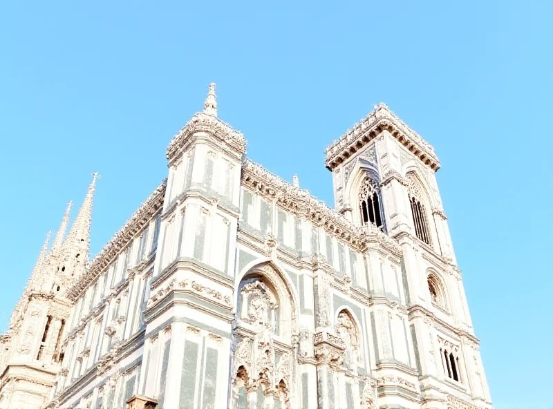 Exterior of the Siena Cathedral, showcasing its intricate gothic architecture and stripy black-and-white campanile under a sunny sky.