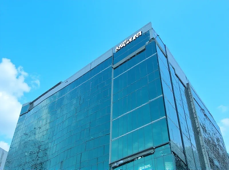 The SKMM (Malaysian Communications and Multimedia Commission) headquarters building in Cyberjaya, Malaysia on a sunny day.