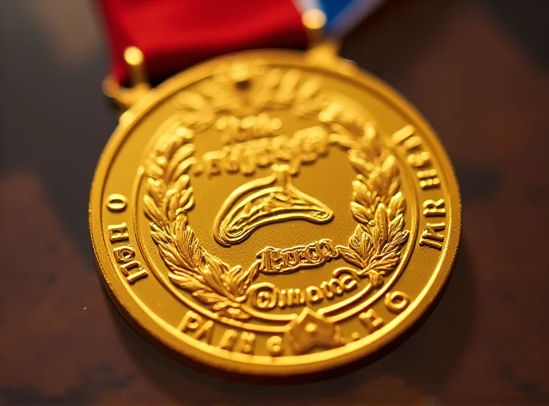 Close-up of a gold medal with the Paris 2024 logo.